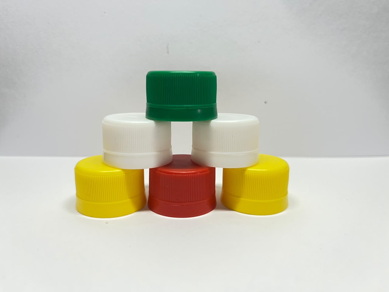PCO 1810 caps in orange and green