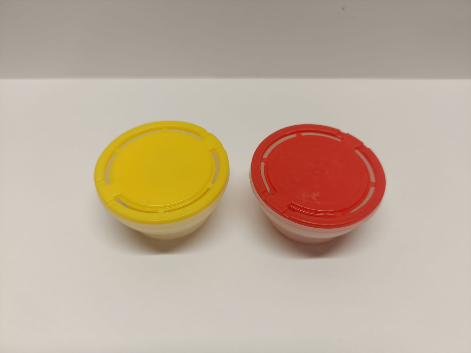 Red and yellow spout caps